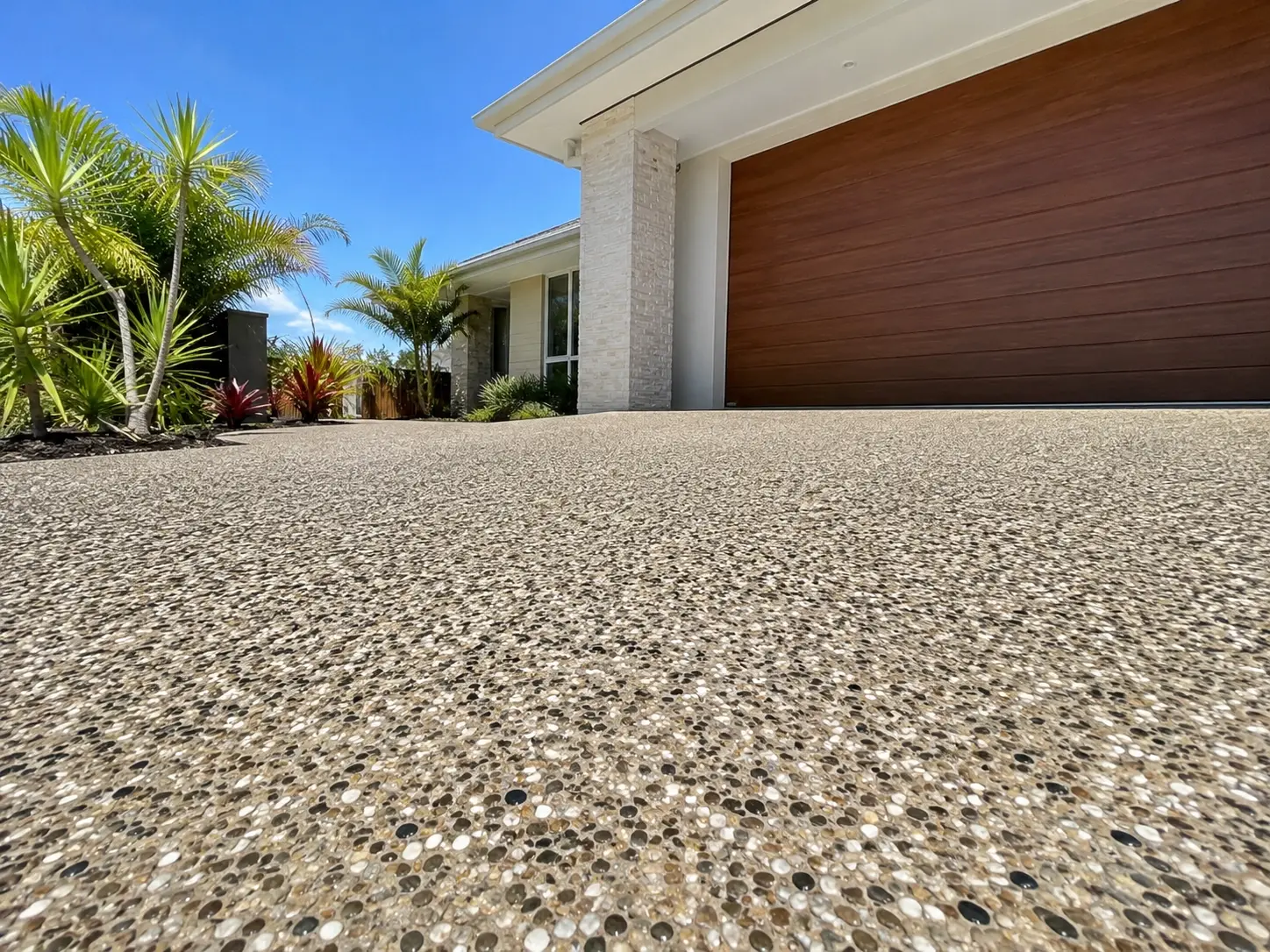 Concrete driveway leading up to a home